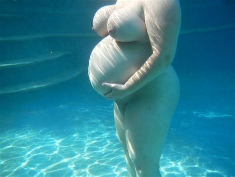 Busty Pregnant Babe Floating Underwater Porn Photo