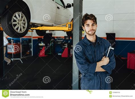 Mechanic In Automobile Service Station Stock Photo Image Of Looking