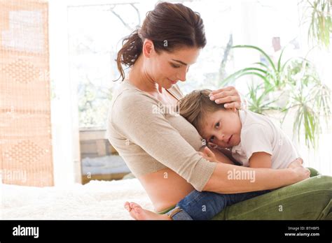 Mother Hugging Sad Son Stock Photo Alamy