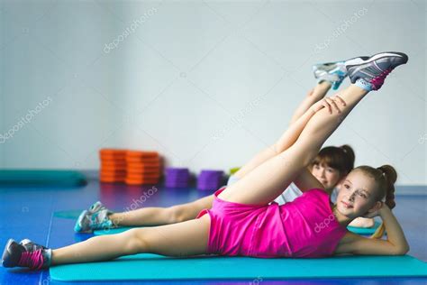 Two Girls Doing Yoga Stretching In Fitness Class Stock Photo By Liudaboich Gmail Com