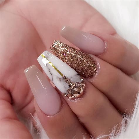 Marble Nail Art With Pink And Gold Glitters On Acrylic Nails Coffin