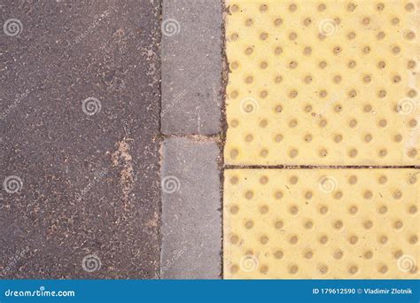 Yellow Dot Tactile Paving For Blind Handicap On Tiles Pathway In Japan