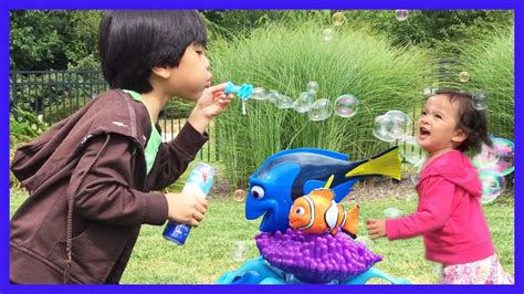 Fun playing outdoors with Bubbles, kids blowing bubbles ...
