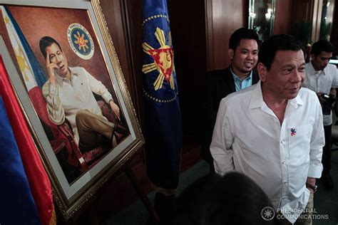 Nov 08 2016 President Rodrigo Duterte Poses Alongside His Portrait
