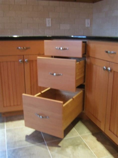 Decide what kind of fitting you prefer in your tall kitchen. Instead of a lazy susan or blind pullout, how about these ...