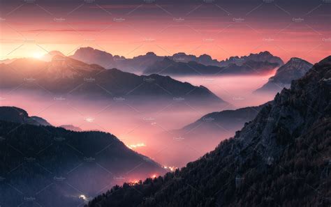 Mountains In Fog At Beautiful Sunset Containing Mountain Rock And Fog