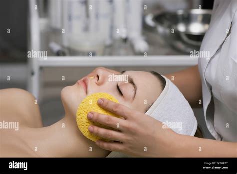 Beautiful Young Woman Having Face Cleaning Treatment Cosmetology Face Lifting Massage In Beauty