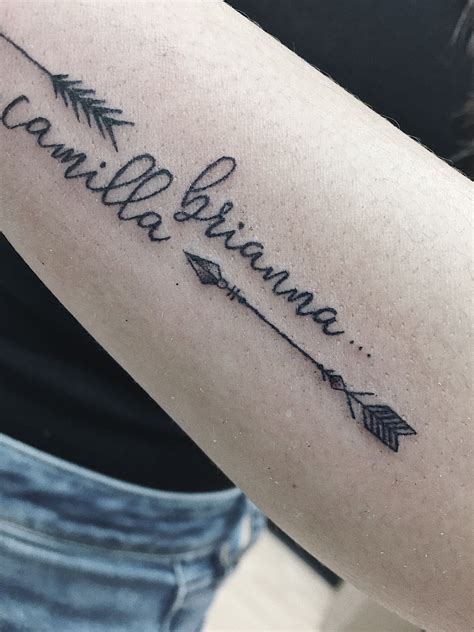 A name tattoo is a token of loyalty and eternal remembrance and realistically to a parent there is nothing more of a masterpiece than their children. Arrows + daughters' names tattoo (detail shot) | Name ...