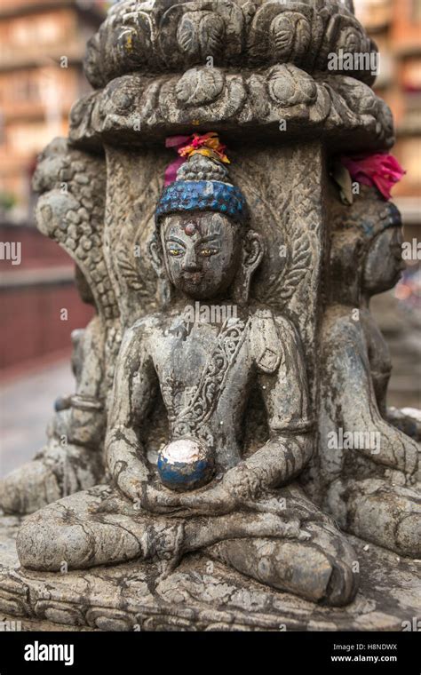 Buddha Statue On The Square Near Swayambhunath Stupa In Kathmandu