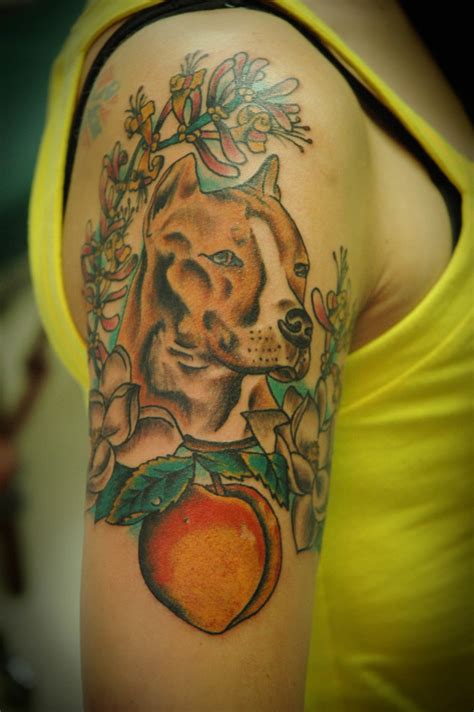With over 20 years of experience tattooing along with extensive training, we are happy to be here to help with your wants and needs. American Bulldog and Georgia Peach Tattoo with Magnolias a ...