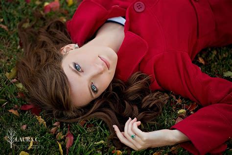 Erin Cejka Laying In The Fall Leaves Poses For Senior Girls