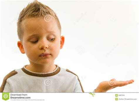Child Showing Something On Hand Stock Photo - Image: 5091318