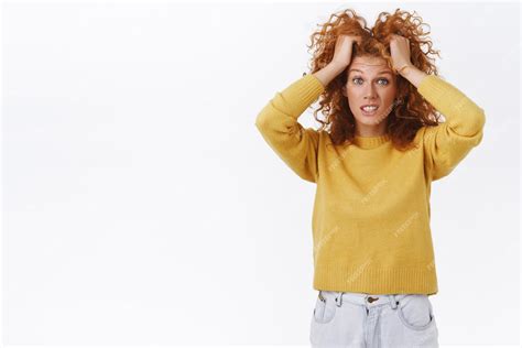 Free Photo Troubled Confused Pretty Clumsy Redhead Girl With Curly Hair Having Problem Raising