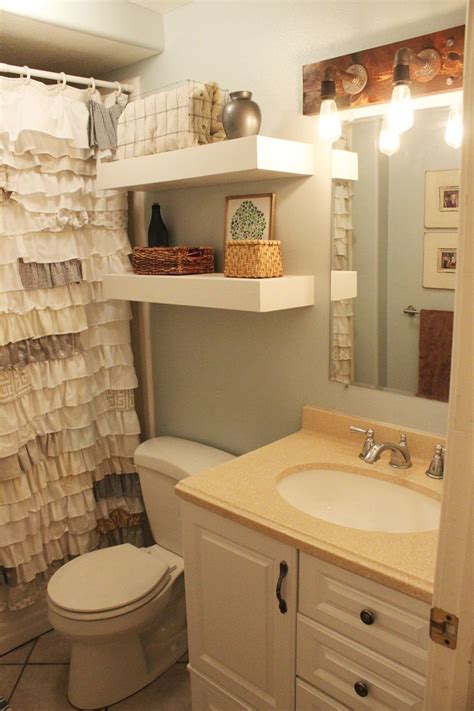 Floating shelves above toilet for toilet paper, hand towels. How To Reinvent Your Bathroom With Over The Toilet Shelves