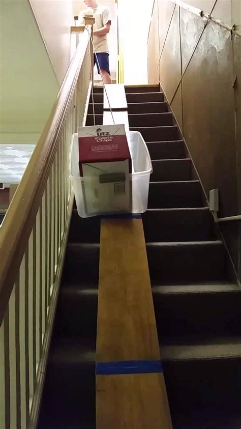 How You Move A Lot Of Heavy Boxes Down A Long Flight Of Stairs By