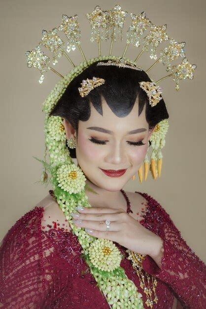 premium photo beautiful model wearing javanese indonesian wedding dress in an indoor