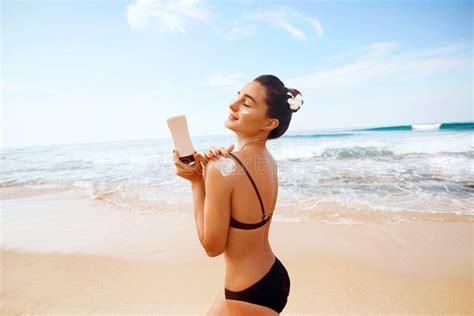 Woman Applying Sunscreen Creme On Tanned Shoulder Skincare Body Sun Protection Sun Cream Stock