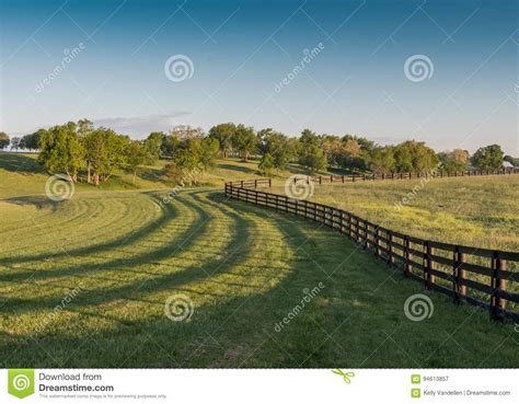Farm Fence With Fiery Stormy Sunset Clouds In African Landscape Royalty