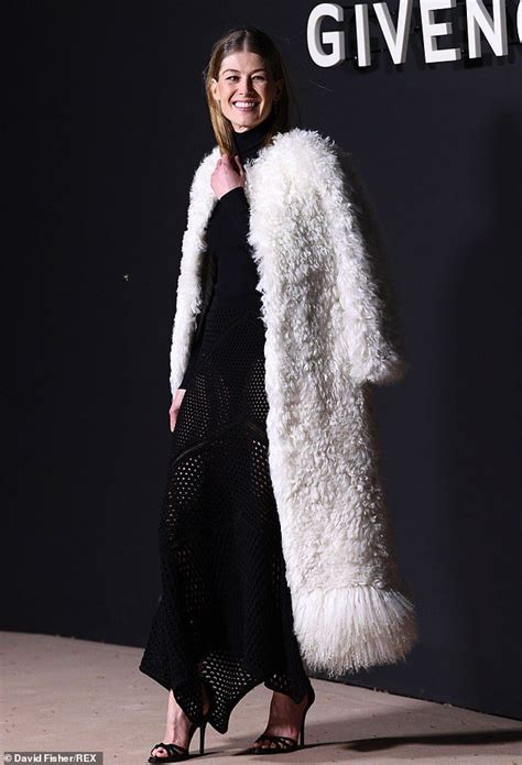 Rosamund Pike Highlights Her Slender Frame In Revealing Net Skirt Net