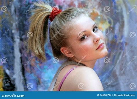 Portrait Of A Natural Blonde Teen Girl With A High Ponytail Youth
