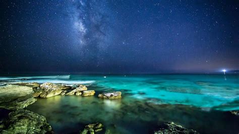 Starry Night Sky Over The Sea Wallpaper Backiee