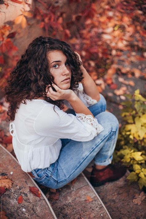 Beautiful Young Woman With Curly Hair Blue Eyes And Freckles Del Colaborador De Stocksy Maja