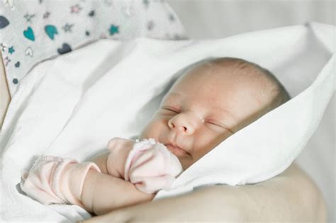 Premium Photo Sleeping Newborn In Mothers Hands