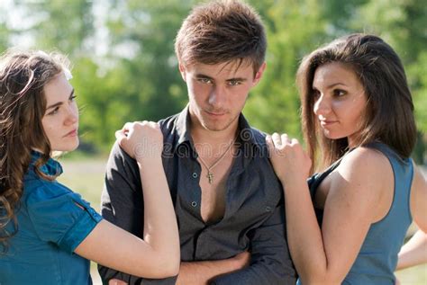 Love Triangle One Man Two Women Posing Outdoors Stock Image Image Of