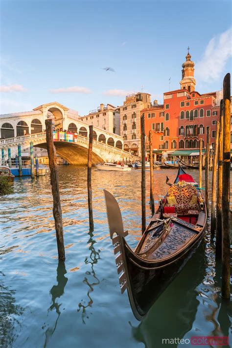 Rialto Bridge At Sunset And Gondola Venice Italy Royalty Free Image