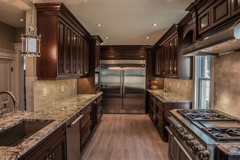 This kitchen cabinets combines stained and painted cabinetry and the simple door style keeps it from being too traditional. Classic: Timeless style characterizing the simplicity and elegance in 2021 | Easy kitchen ...