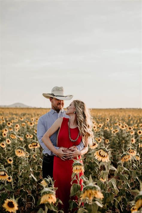j smith photography western oklahoma couples engagement photo session in sunflower field