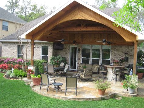 Obviously, a covered area protects you and your guests from the rain and sun. Custom designed and built gable roof addition with arch, outdoor kitchen, and flagstone patio ...