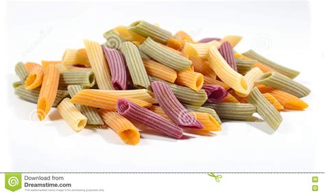 Heap Of Colored Uncooked Italian Pasta Penne On A White Stock Photo
