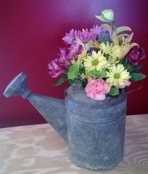 Flowers in an old watering can | Watering can, Canning, Watering