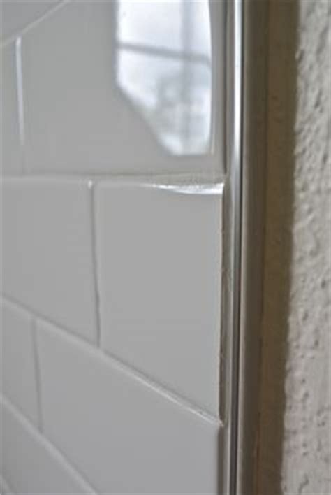 Here a tile trim is fitted to a wall that is not straight, this can be difficult to overcome and so a workaround solution is demonstrated. Schluter edge with tile | Bath remodel | Pinterest | Bath ...