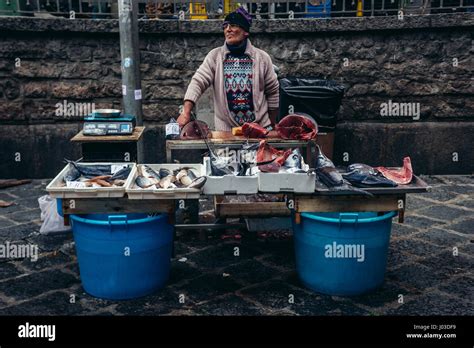 Man Selling Fishes On Famous Old Fish Market Called La Pescheria In