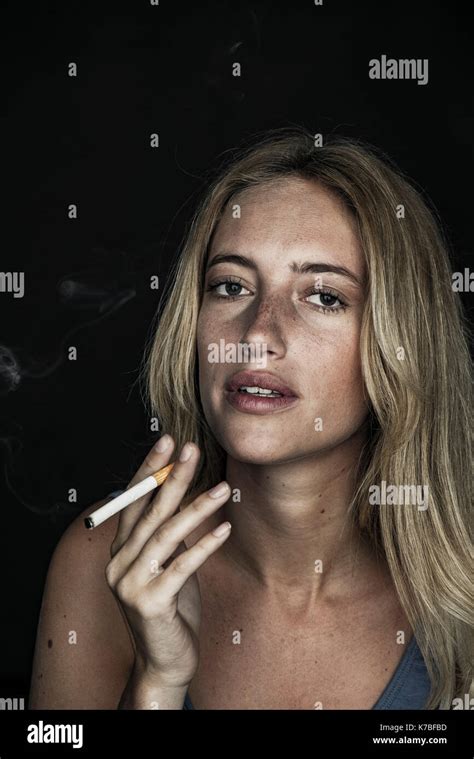 Young Woman Smoking Cigarette Portrait Stock Photo Alamy