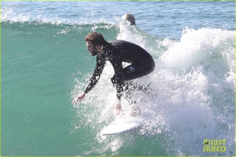 Liam Hemsworth And Brother Luke Show Off Their Wetsuit Bods At The Beach