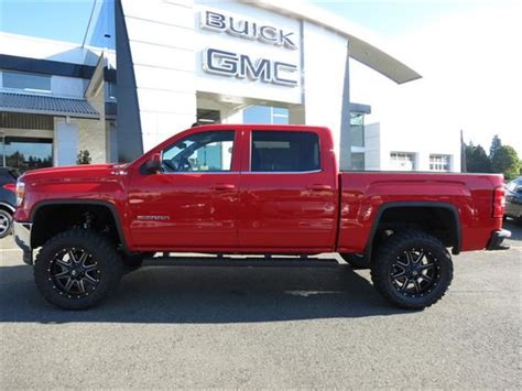 With A Red Lifted 2014 Gmc Sierra In The Drive Way 2014 Gmc Sierra