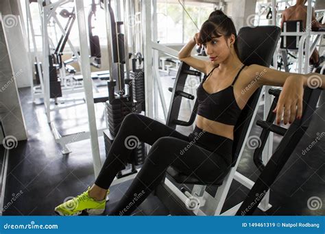 Sport Woman Taking A Break After Exercises On Bench In Gymtired Young