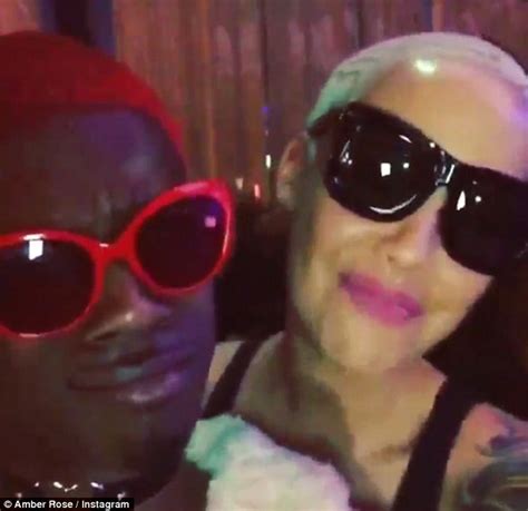 amber rose squeezes into a swimsuit as blac chyna goes topless daily mail online