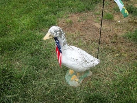 The Vintage Concrete Goose Statue I Repainted For My Neighbor Concrete