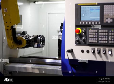 Process Of Automatic Loading Detail Into Cnc Lathe Machine With The