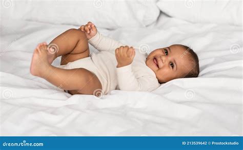 Cute Little African American Infant Lying In Bed Stock Photo Image Of