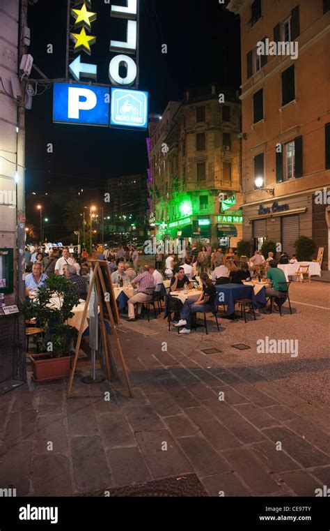 People Eating And Drinking In The Street Bars And Restaurants At Night