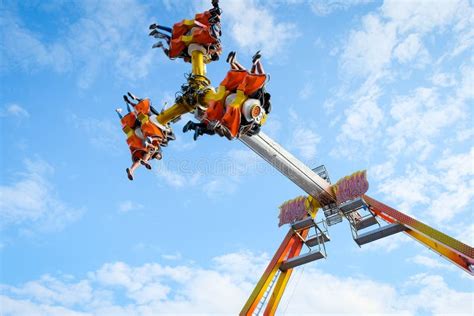 teens go upside down on carnival ride editorial stock image image of