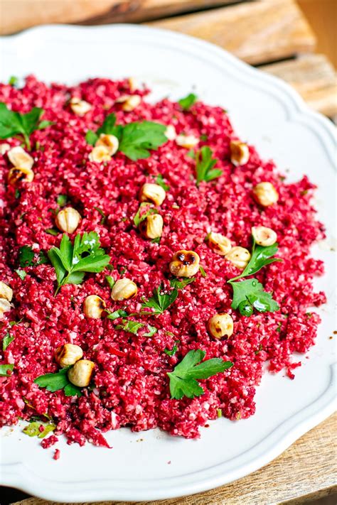 Remove from the oven and sprinkle the salt over the vegetables, add half of the pomegranate seeds and toss to combine. Cauliflower Couscous With Beets & Toasted Hazelnuts