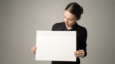 Woman Holding A Sheet Of Paper In Her Hand Stock Image Image Of