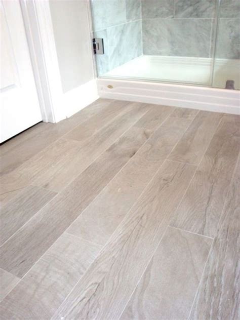 Wood floors in the bathroom, once considered impractical, are now often a realistic choice, thanks to modern materials and sealers. Love the light color laminate for the bathroom - lightens ...