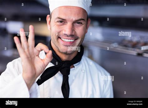 Happy Chef Making Ok Sign In Commercial Kitchen Stock Photo Alamy